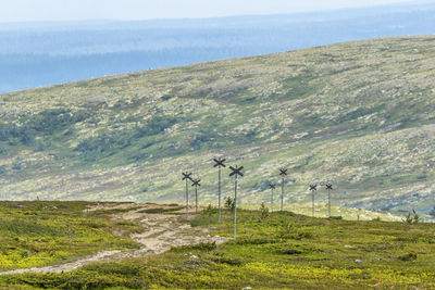 Scenic view of land and sea against sky