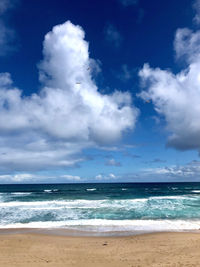 Scenic view of beach against sky