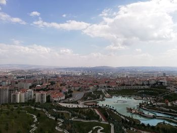 High angle view of buildings in town against sky