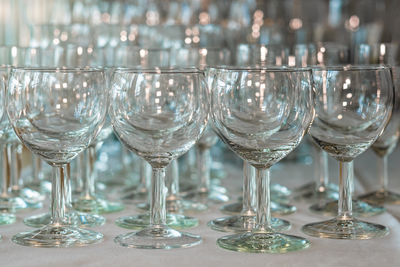 Close-up of wine glasses on table