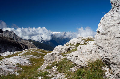Scenic view of mountains against blue sky