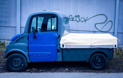 Side view of vintage car on road