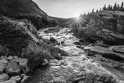 A sunrise over swiftcurrent river at glacier national park in many glacier, montana, usa