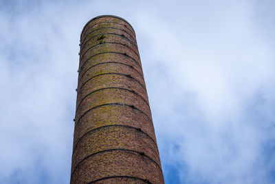 Low angle view of smoke stack against sky