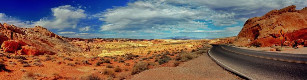 Panoramic view of road amidst mountains against sky