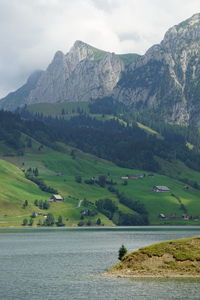 Scenic view of landscape and mountains against sky