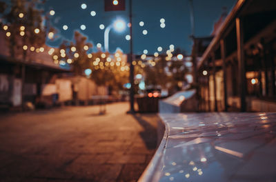 Defocused image of illuminated restaurant at night