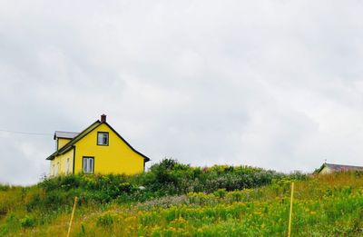 House on field against sky