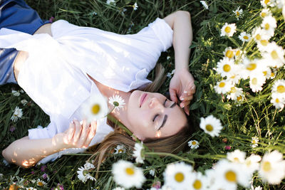 Low section of woman with flowers