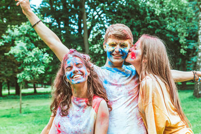 Portrait of smiling friends enjoying at park