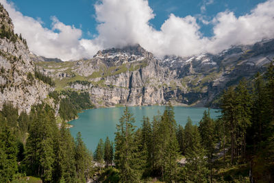 Scenic view of lake and mountains against sky