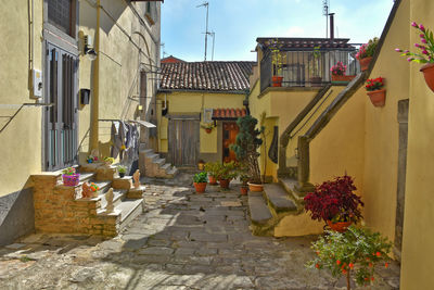 A narrow street between old buildings in melfi, a medieval village in basilicata region, italy.