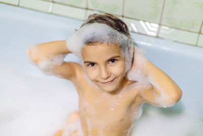 High angle view of girl taking bath