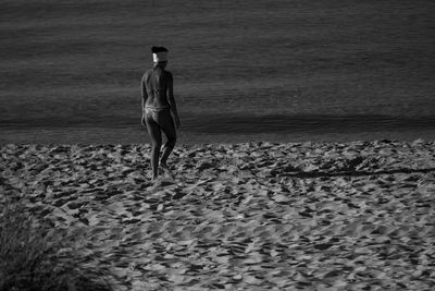 Full length of man walking on beach