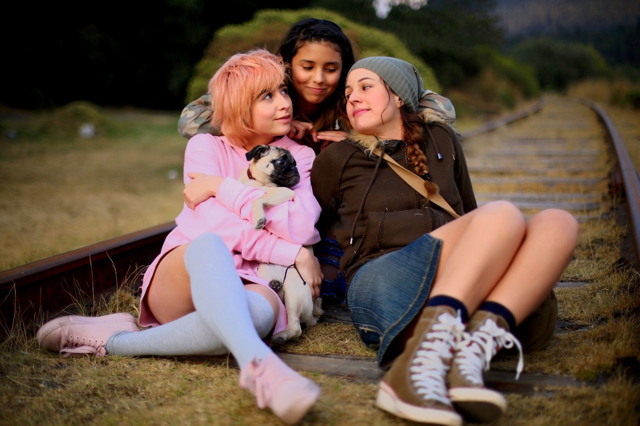 child, girls, friendship, sitting, females, happiness, people, embracing, togetherness, smiling, outdoors, cheerful, night, adult, period costume