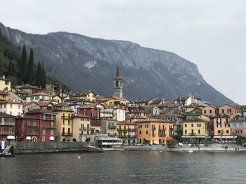 Townscape of varenna by sea against sky at lake como 