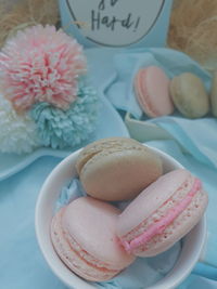 High angle view of macaroons in bowl on table