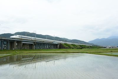 Tokaido shinkansen running against the background of mt. ibuki - maibara - gifuhashima, 2023, may