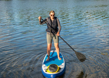 Man kayaking in lake