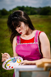 Close-up of cute girl holding table
