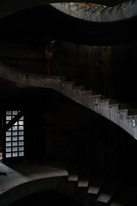 Man standing by staircase in building