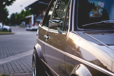 Close-up of car on street