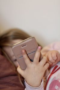 Midsection of woman using mobile phone