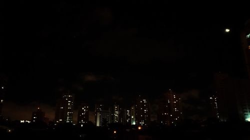 Illuminated buildings in city at night