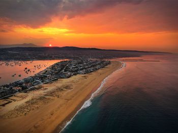 Scenic view of beach against sky during sunset