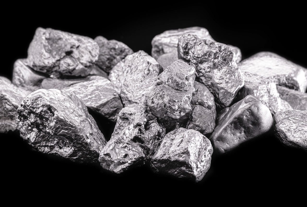 CLOSE-UP OF ROCKS AGAINST BLUE BACKGROUND