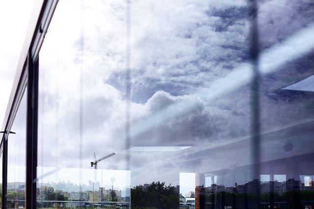 architecture, built structure, glass - material, low angle view, building exterior, sky, window, cloud - sky, transparent, weather, cloudy, building, modern, city, reflection, day, glass, cloud, office building, overcast