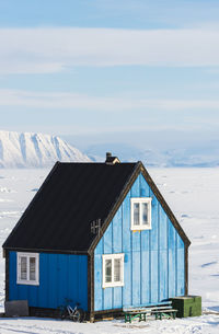 Blue building in remote landscape