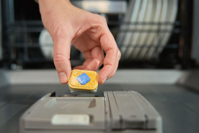 Cropped hand of person using mobile phone