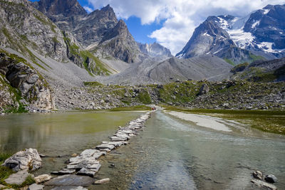 Scenic view of lake and mountains against sky