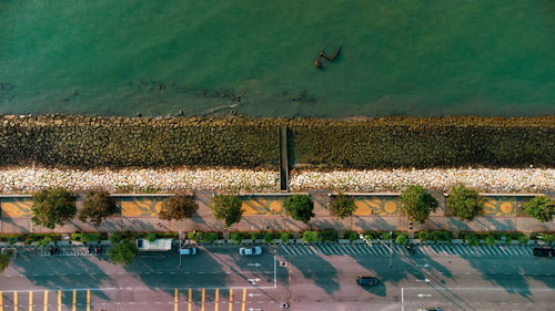 Aerial view of road by sea