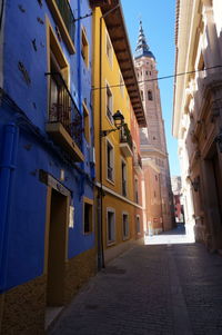 Narrow street amidst buildings in town