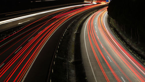 High angle view of light trails on road at night