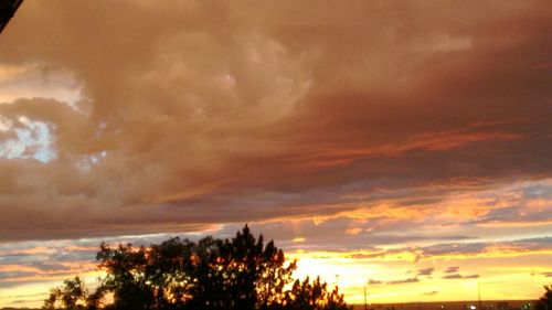 Low angle view of cloudy sky at sunset