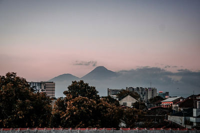 High angle view of buildings against sky at sunset