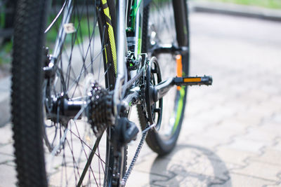 Close-up of bicycle parked on street