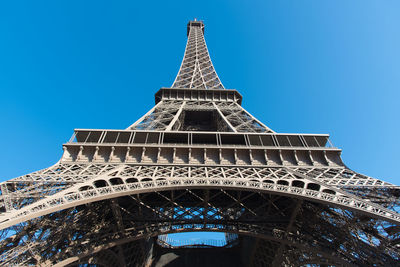 Low angle view of eiffel tower against clear blue sky during sunny day