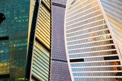 Low angle view of sunset reflected off office buildings