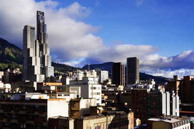 Modern buildings in city against sky