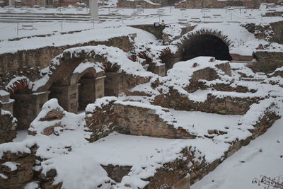 Snow covered stone wall