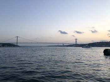 View of suspension bridge over sea