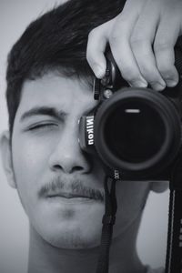 Close-up portrait of man photographing