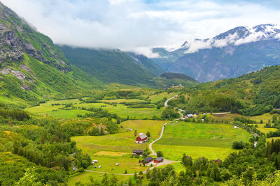Traditional colored wooden house in norway at summer day. country houses in village in norway