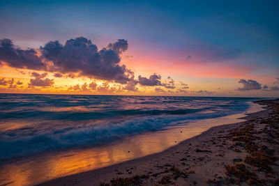 Scenic view of sea against sky during sunset