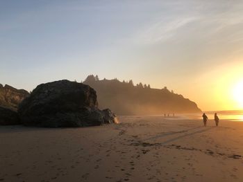 Scenic view of beach against clear sky