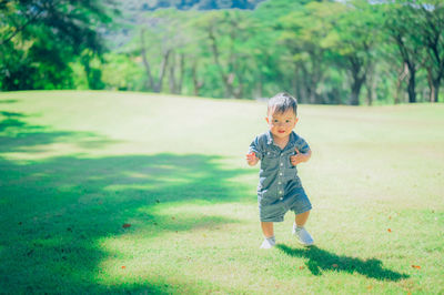 Full length portrait of cute baby girl on land